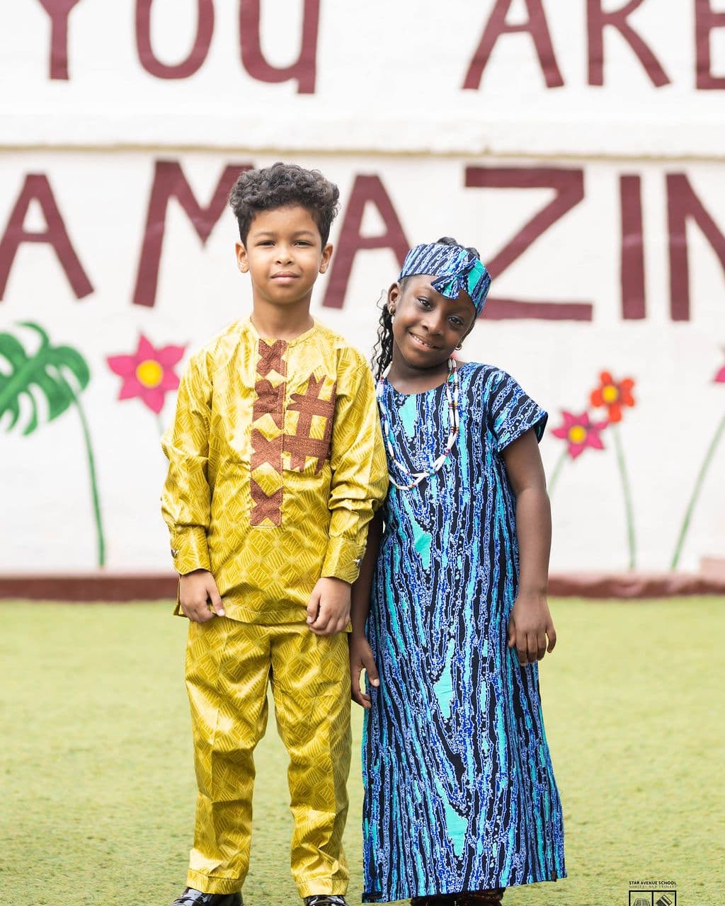 Dressed for the day in front of the painted wall
