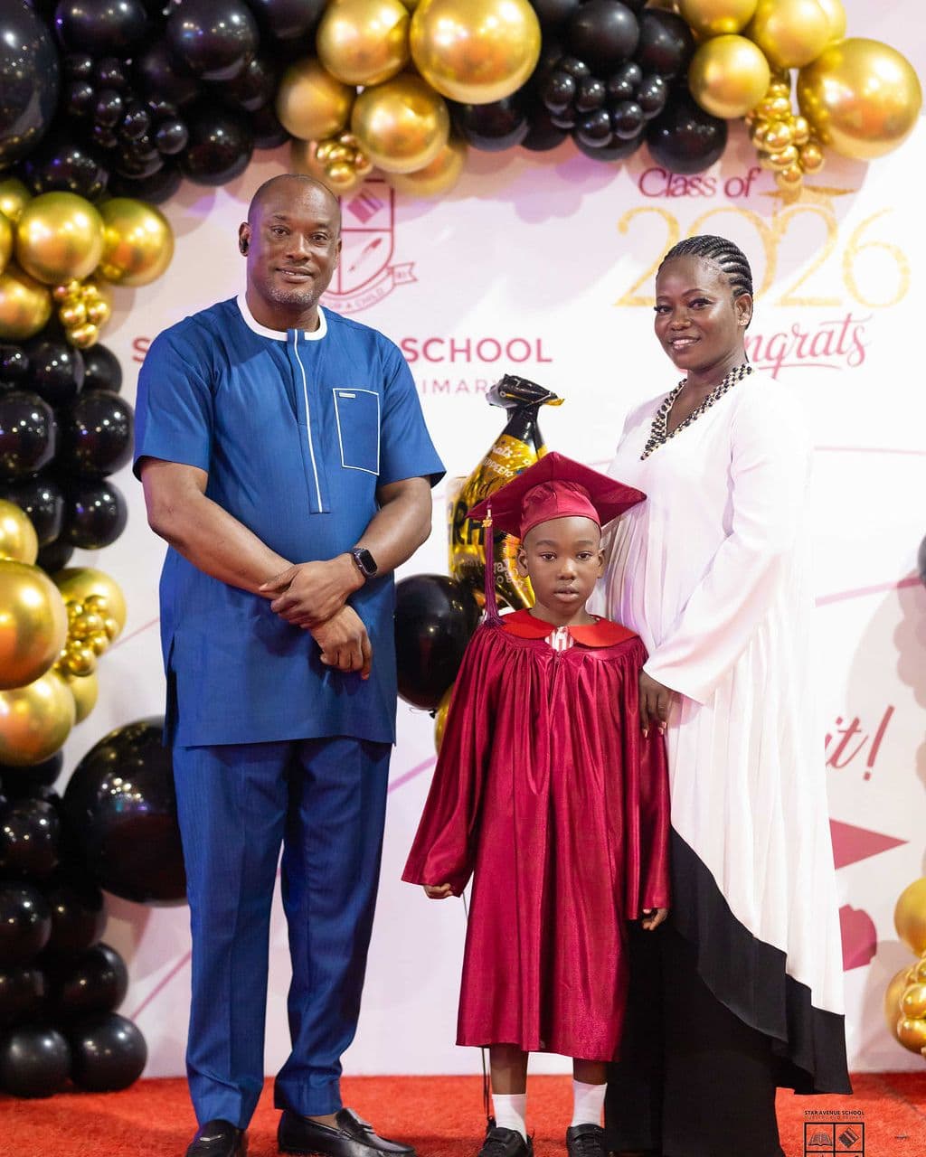 A graduate with her parents after the ceremony