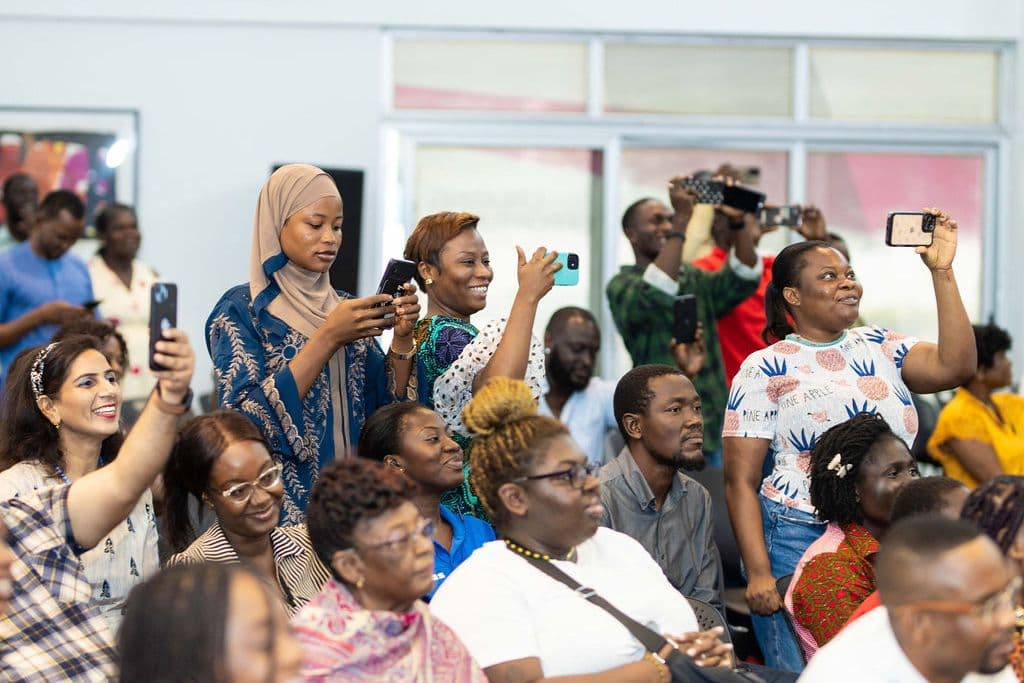 Parents filming from the front rows